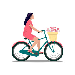 A girl with dark hair in a pink dress on a bicycle with a basket of flowers