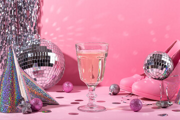 Glass of champagne with silver disco ball