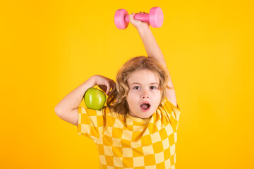 Child boy working out with dumbbells. Kids sport and active healthy life. Sport and kids training.