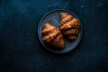 Fresh baked croissant with jam