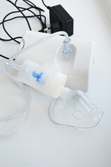 Fototapeta na wymiar inhaler for the treatment of respiratory tract, cough. viral diseases. covid.