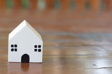 Obraz na płótnie Canvas Two-digit wooden house model, real estate concept.