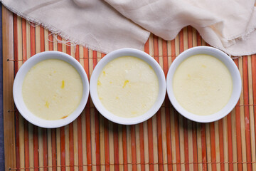  Caramel pudding in a glass jar on table 