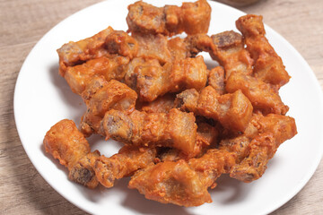 Deep fried pork belly with fish sauce and spicy dipping sauce