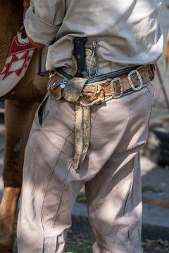Details of the typical gaucho sash with the fac&oacute;n on it