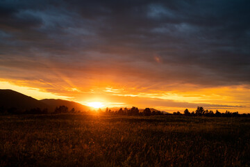 Beautiful Sunset in Croatia. Sunlight and Mountains in Background.