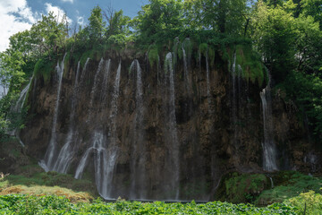 Plitvice Lakes in Croatia. Sightseeing place. Very popular among tourists. Beautiful Landscape and Nature. Summer view of beautiful waterfalls in Plitvice Lakes National Park