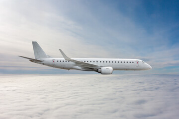 Fototapeta na wymiar White passenger jet plane flies in the air above the clouds