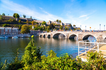 The stone arches of the bridge of Jambes over the Meuse at the foot of the hill of the Citadel of...