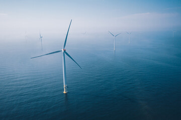 Wind turbine. Aerial view of wind turbines or windmills farm field in blue sea in Finland. - Powered by Adobe