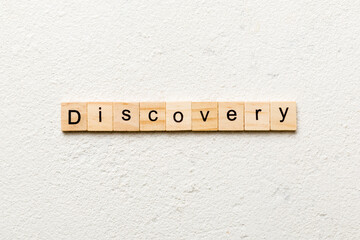 discovery word written on wood block. discovery text on table, concept