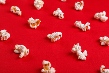 Obraz na płótnie Canvas popcorn macro on a red background