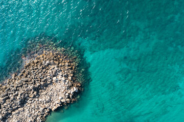Rocks coast in the transperency Mediterranean sea top view