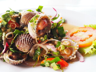 Spicy cockles salad is Thai style spicy seafood. Boil cockles and season with spicy and sour salad...