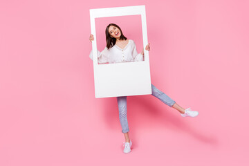 Full length photo of cheerful positive lady arm hold big white frame offer services photographer...