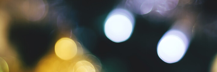 Blurred lights abstract background, banner texture. Defocused bokeh header. Wide screen wallpaper. Panoramic web banner with copy space for design