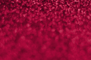 Trendy viva magenta, pink sparkling glitter bokeh background, abstract defocused texture. Holiday...