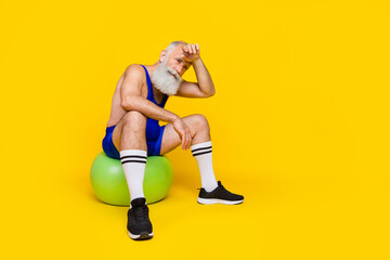 Photo of active energetic coach do cardio exercise fat burn activity hobby time fitness gym empty space isolated on yellow color background