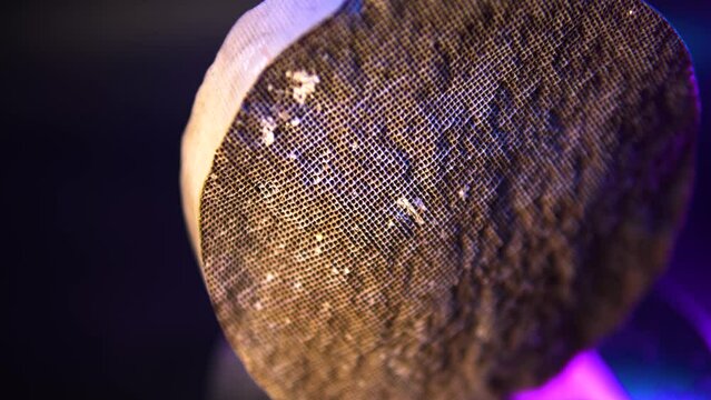Used, destroyed, with deformation. Filter of harmful emissions, catalyst from the vehicle. detail close up view. Material containing precious metals. Muffler of the exhaust system. 