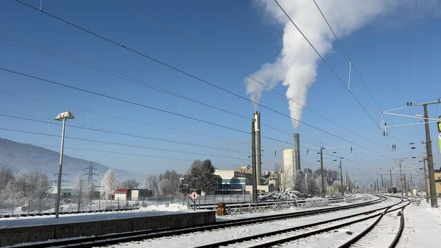 district heating plant and railroad tracks in winter