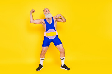 Fototapeta na wymiar Full length portrait of confident grandfather point finger himself show biceps wear fluffy soft belt isolated on yellow color background
