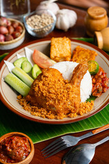 Ayam Goreng Padang. Traditional fried chicken with spice crumbs from Minangkabau, West Sumatra. 