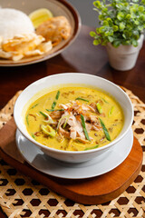 Soto ayam is a typical Indonesian food in the form of a kind of chicken soup with a yellowish sauce.