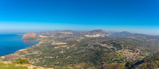 Panorama of the west coast of Sicily with inland view and seaside, the Gulf of Bonagia on the Tyrrhenian Sea stretched from Erice to Monte Cofano. Inland the marble quarries and the town of Valderice