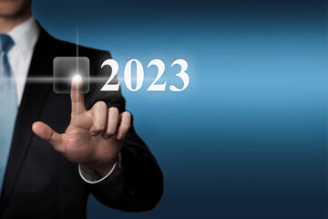 New Year 2023 - finger pressing virtual touchscreen button
