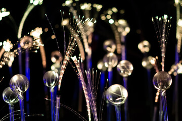 White, golden yellow and blue fiber optic strands or filaments creating a magic fantastic abstract...