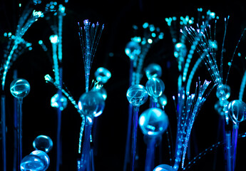 Blue fiber optic strands or filaments creating a magic fantastic abstract background - obrazy, fototapety, plakaty