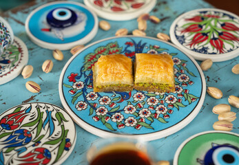 Photograph of Turkish Baklava in Ottoman Tile Turkish Coffee Cup and Turkish Tea Concept, Uskudar...