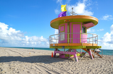A lifeguard tower or shelter on Miami's South Beach. Each mile will have one tower. They are often vibrant and vivid. There will be a lifeguard at each stop. Their jobs are to protect visitors. 