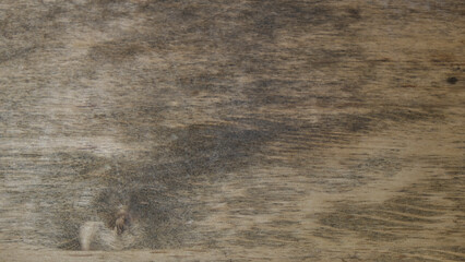Fondo de madera vieja rústica de color marrón oscuro mate con formas abstractas  y textura rugosa