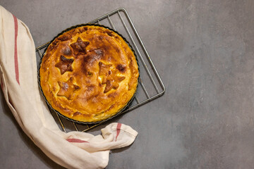 Pie with Christmas pattern - Christmas trees and stars. top view . On a grey background