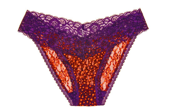 Underwear woman isolated. Close-up of luxurious elegant pink lacy thongs panties with colorful orange stars pattern isolated. Clipping path. Macro. Underwear fashion.