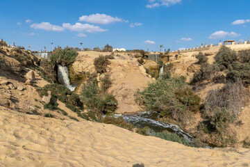 Fayoum oasis waterfall on a sunny day.