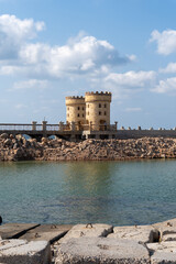 Towers of the citadel of Alexandria, seen from the side of the port, on a sunny day.