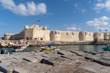 Citadel of the city of Alexandria, seen from the part of the sea full of ships, on a sunny day.