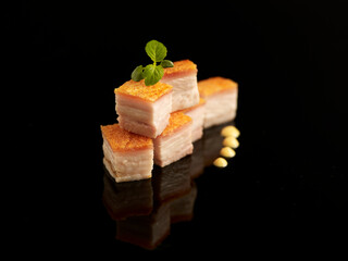 Roasted Pork Belly served in dish isolated on table top view of food