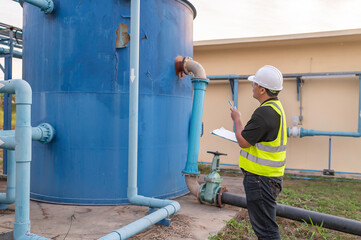 Environmental engineers work at wastewater treatment plants,Male plumber technician working at water supply
