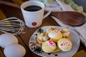 biscuit, biscuit, chocolate, with chocolate drops, traditional, cream, milk, chocolate, and with toppings, a delight with coffee made in an artisan way, set on a rustic wooden table.