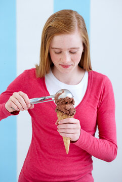 Girl Serving Scoop of Ice Cream