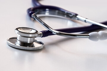 Stethoscope on a light background, close-up. Space for text