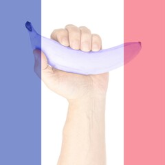 Double exposure of French flag with Blue banana in man s hand