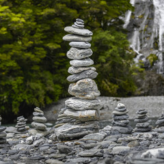 Stacks of balancing stones on a rocky landscape; New Zealand