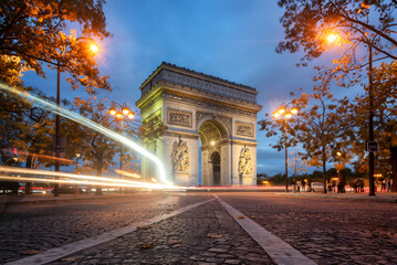 Fototapeta na wymiar Long exposure with light trails at the Arc de Triomph in Paris, France