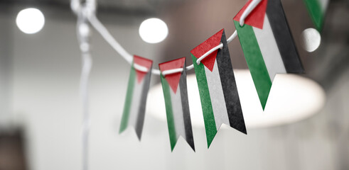 A garland of Palestine national flags on an abstract blurred background