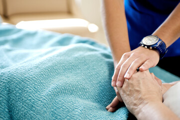 Healthcare worker caring for a hospital patient