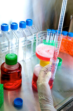Lab technician works with medication and equipment in a hospital lab